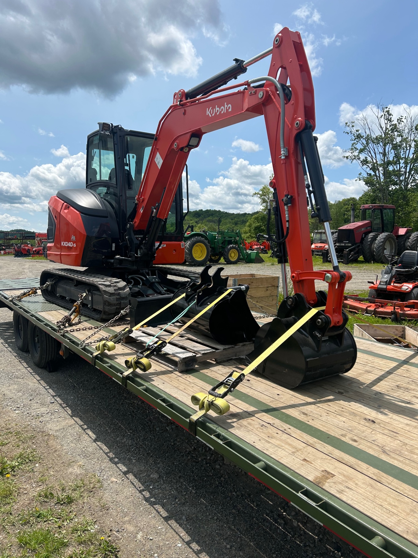 Kubota KX040-5 mini excavator chained down for delivery