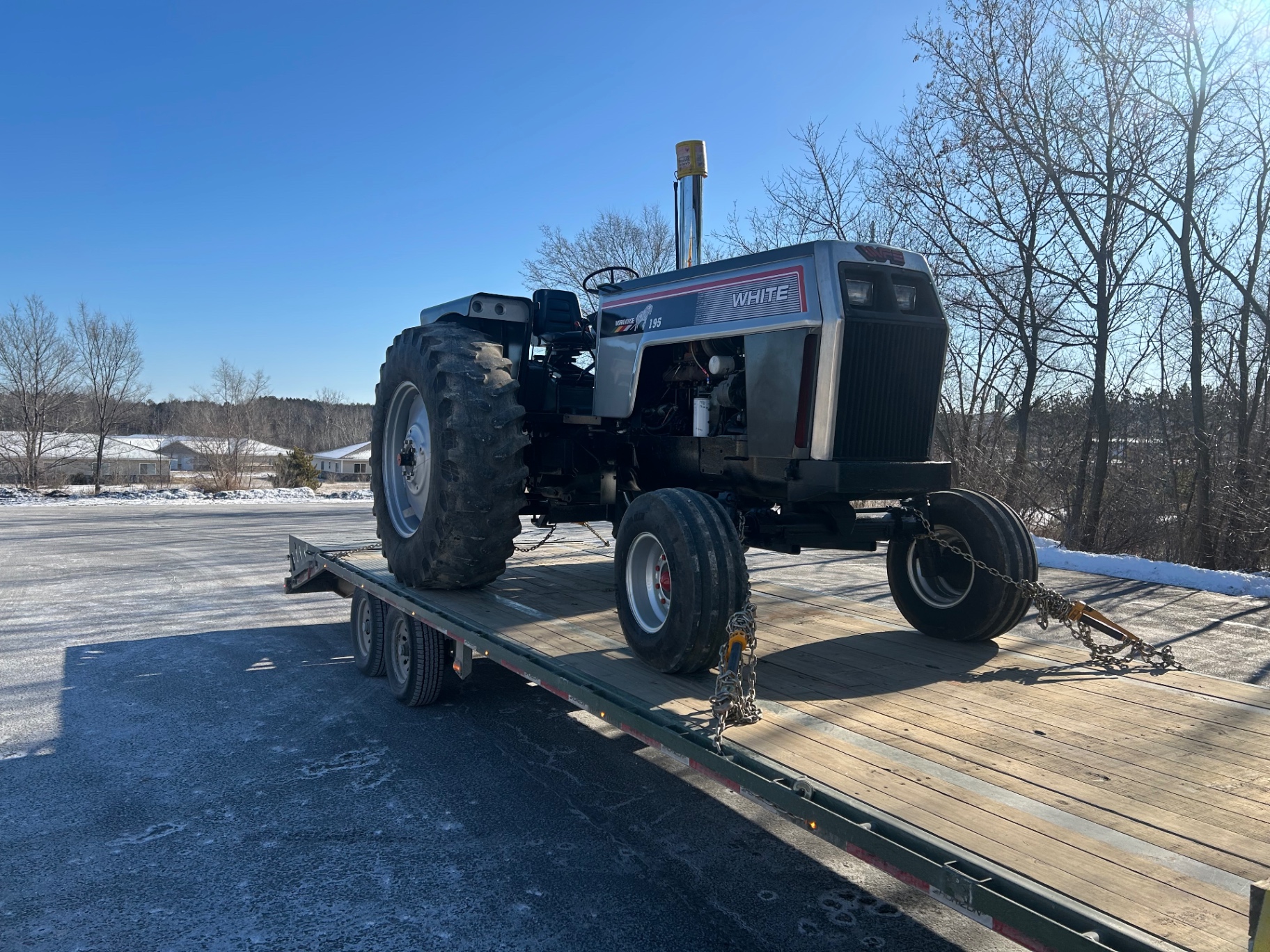 Vintage White 195 tractor loaded for delivery