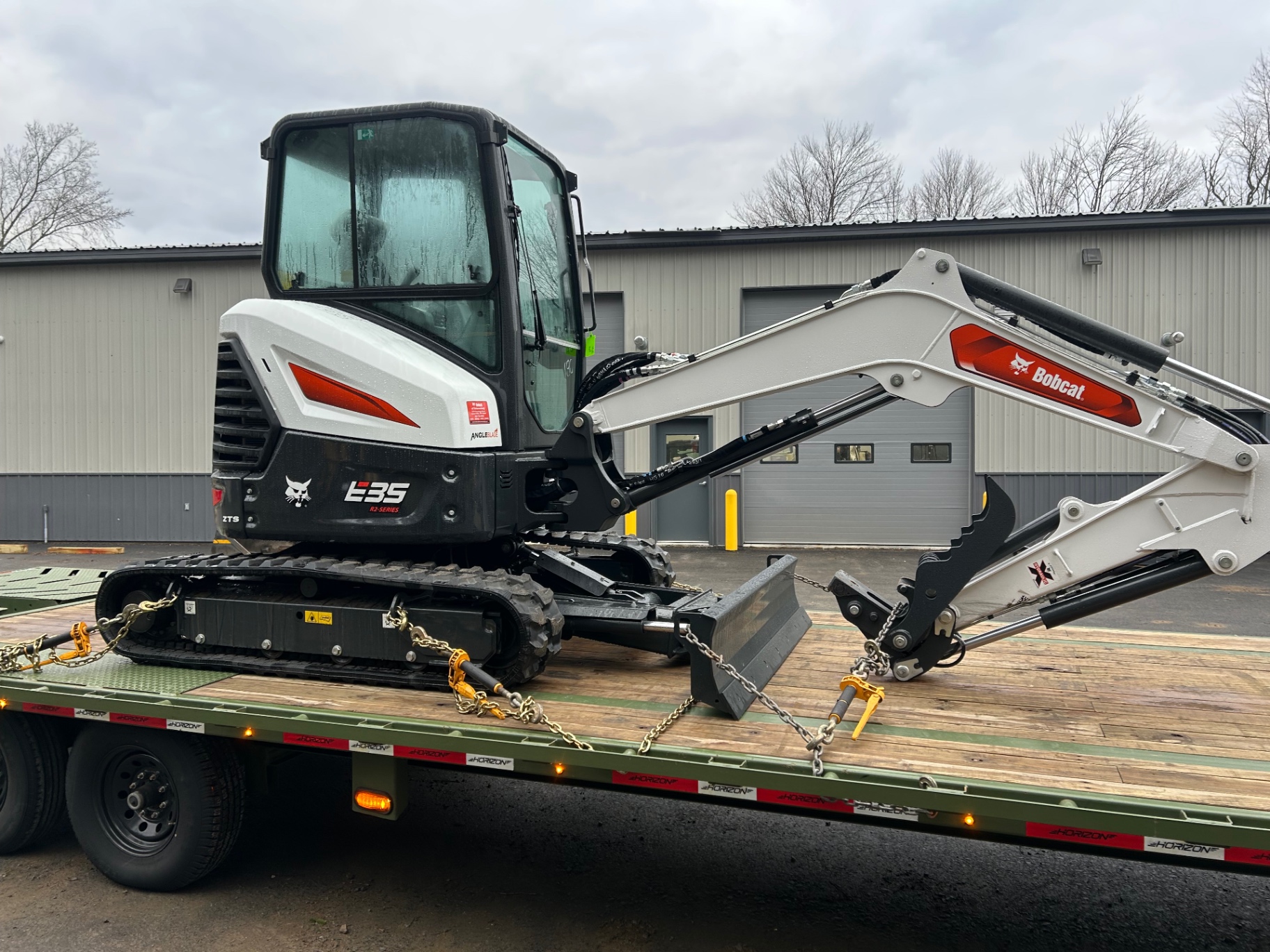 New Bobcat E35 mini excavator chained down for delivery